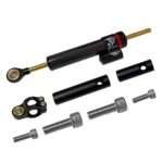 Damper Amortiguador de Dirección Color Fibra Carbono + adaptador (Adaptable a Ecoxtrem Armored, Kukirin, etc)